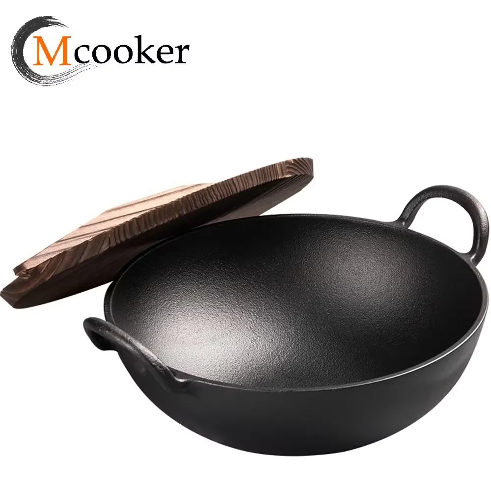 Cast iron wok with two handles and oil coating